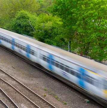 Moving train on track.  Motion blur to show movement Stock Photos