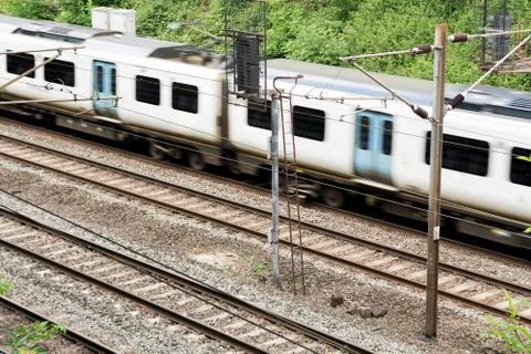 Moving train on the tracks, train is in motion Stock Photos