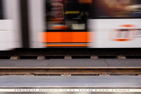 The moving train with a warning sign Stock Photos