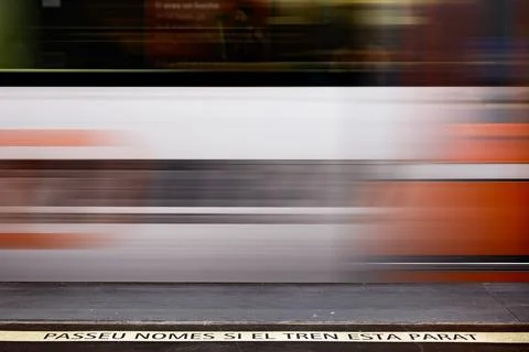 The moving train with a warning sign Stock Photos