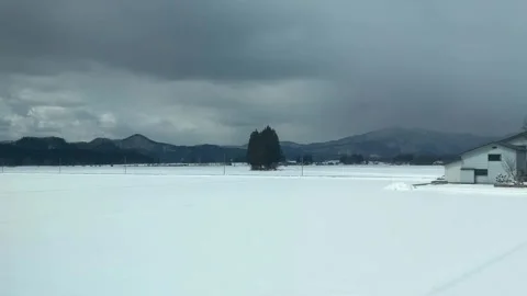 Moving Train Window View of Snow Covered Countryside Japan Stock Footage 346013539