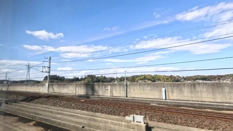 Moving Train Window View of Tokyo Railway and Suburban Landscape Stock Footage 342494302