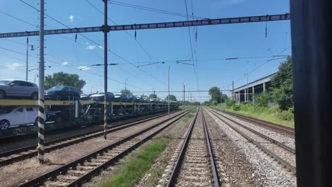Moving Train's Rear Window Passing Motorail Train Full of Cars in Moravia, CZ Stock Footage 277904094