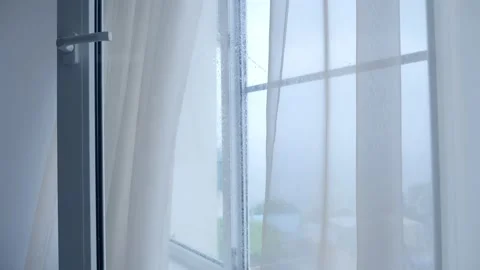 Moving transparent curtains on the window on a rainy day Video stock 156694971