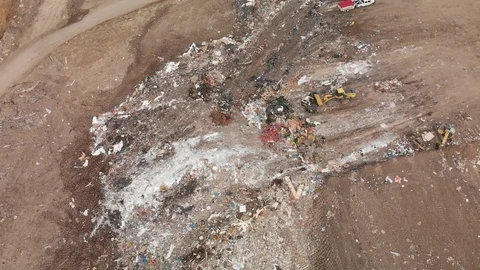 Moving Trash at the landfill Stock-Footage 120815737