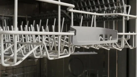 Moving trays inside shiny inox dishwasher Stock Footage 75815221
