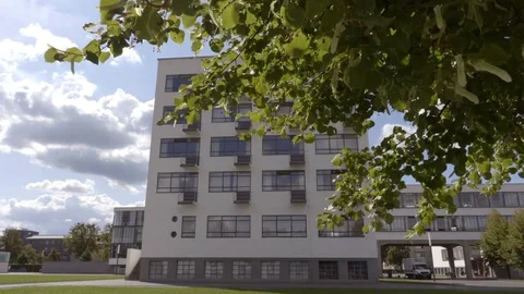 Moving tree leaves with the Bauhaus on the background. September 2017 Stock Footage 83633471