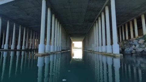 Moving Under Concrete Bridge Pillars Carlsbad Lagoon Sunny Calm Water Stock Footage 331765931