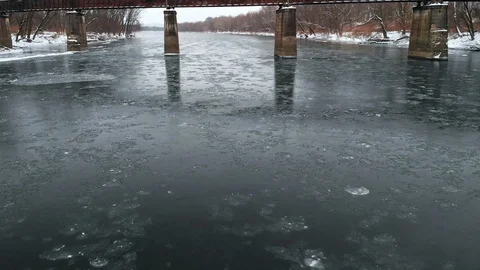 Moving Under Railroad Bridge Over Icy River FLY IN SLOW MOTION Stock Footage 102587276