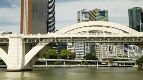 Moving under William Jolly Bridge towards Brisbane cityscape 6K Stock Footage 329337557