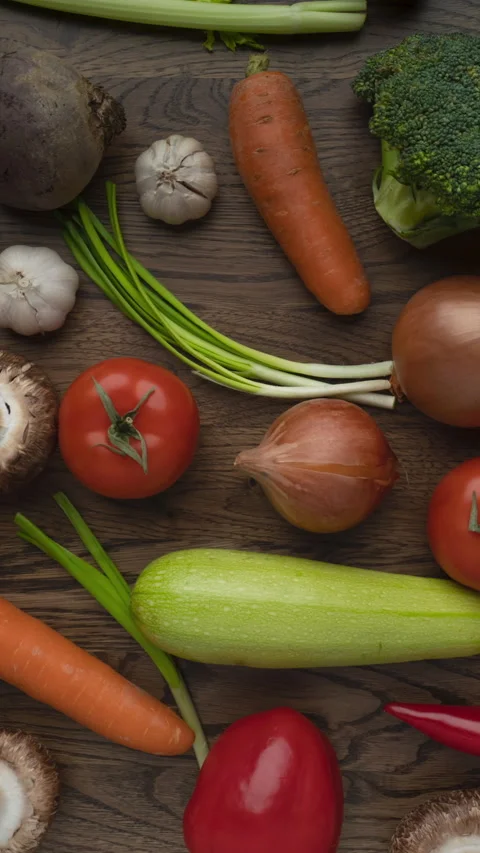 Moving vegetables on kitchen table Stock Footage 276736443