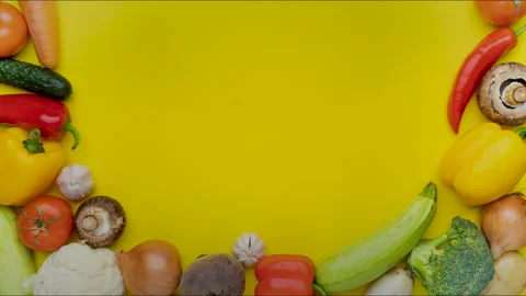 Moving vegetables on yellow background Stock Footage 262458519