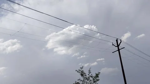 Moving view of cloudy sky and tree branches captured from a bus in India. Natura Stock Footage 332440780