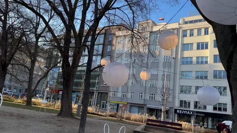 Moving View Of Flickering Hanging Lanterns In Park Among Trees Stock Footage 263750637