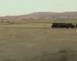 Moving view of steam train travelling through fields SD Footage
