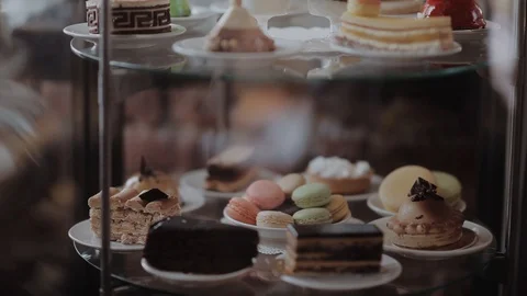 Moving vitrine for mini cakes. Stock Footage 87130963
