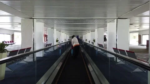 A Moving Walkway or Moving Sidewalk (American English), also known as Autowalk Stock Footage 130222037