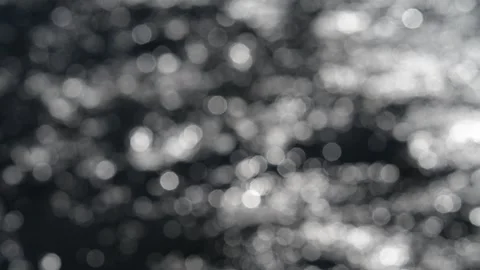Moving water creates a bokeh sparkling abstract effect with light balls on a Stock Footage 339733199