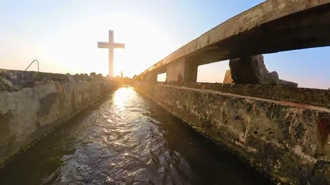 Moving on water surface to crucifix Stock Footage 319669076