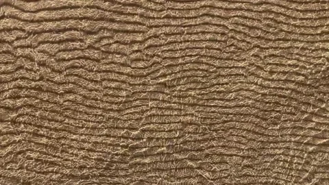 Moving waves above sand texture pattern in shallow water. CloNatural background Stock Footage 158668650