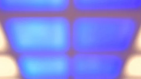 Moving waves of different colors, on a glazed square wall. Out of focuse. Stock Footage 81926709