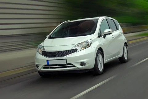 Moving white car Stock Photos