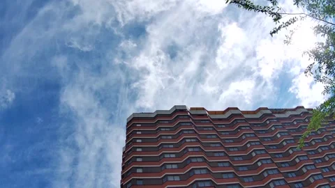 Moving white Cirrus clouds and residential house Stock Footage 130819618