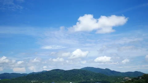 Moving white cloud above high mountain with beautiful blue sky background at  Stock Footage 130577944