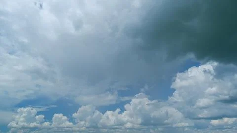 Moving white cloud. Dramatic sky. Rain cloudscape formation in the blue sky Stock Photos