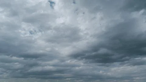 Moving white cloud. Dramatic sky. Rain cloudscape formation in the blue sky Stock Photos
