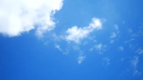 Moving white cloud with flying bird, beautiful blue sky background at day tim Stock Footage 130577589