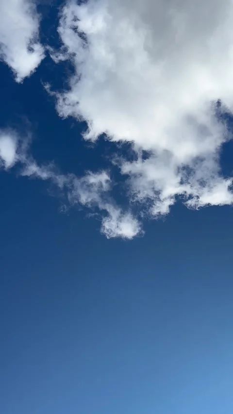 Moving White Clouds Across Bright Blue Sky Video stock 342658808