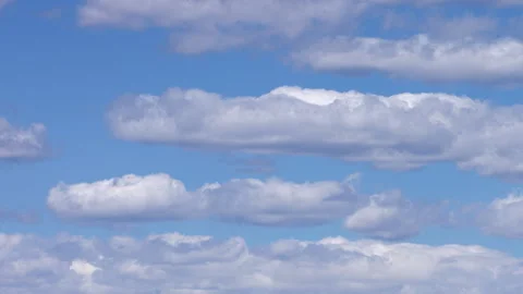 Moving White Clouds Across Brilliant Blue Sky Timelapse Background Stock Footage 337247187