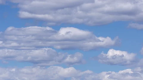 Moving White Clouds Across Brilliant Blue Sky Timelapse Background Stock Footage 337248713