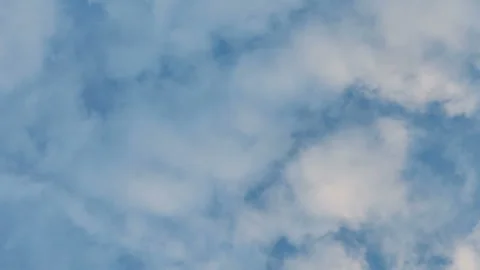 Moving white clouds against the blue sky, time lapse Stock Footage 165343058