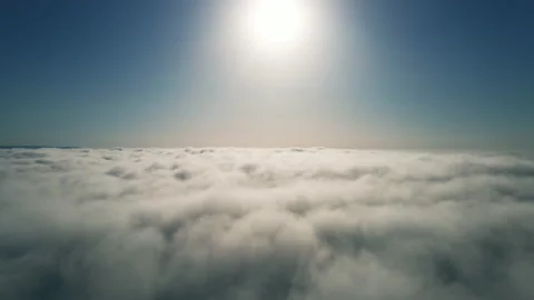 Moving white clouds blue sky scenic aerial view sunrise. Drone flies Stock-Footage 132366993