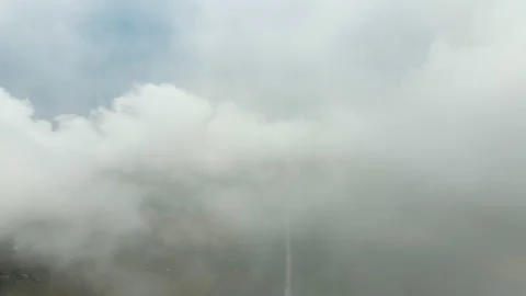 Moving white clouds blue sky on coastline and sea surface, road in woods, Stock Footage 133336663