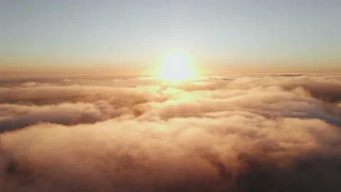 Moving white clouds blue sky scenic aerial view sunset. Sun is hidden at fog Stock Footage 142954018