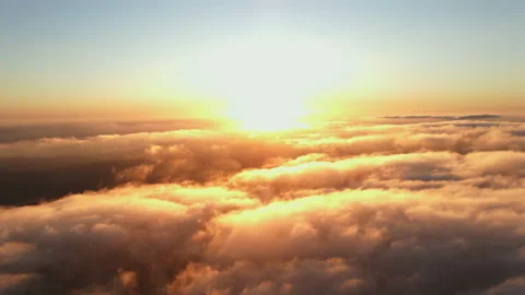 Moving white clouds blue sky scenic aerial view sunset. Sun is hidden at fog Stock Footage 142954068