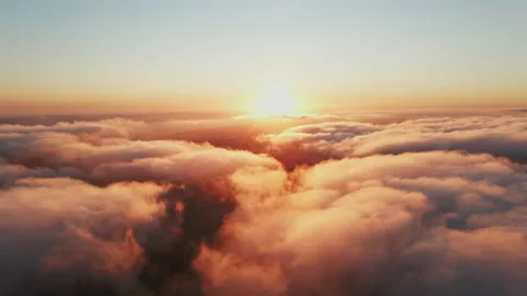 Moving white clouds blue sky scenic aerial view sunset. Sun is hidden at fog Stock Footage 142954209