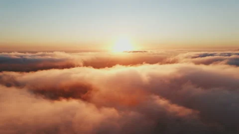 Moving white clouds blue sky scenic aerial view sunset. Sun is hidden at fog Stock Footage 142954307