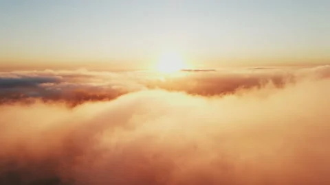 Moving white clouds blue sky scenic aerial view sunset. Sun is hidden at fog Stock Footage 142954354