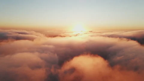 Moving white clouds blue sky scenic aerial view sunset. Sun is hidden at fog Stock Footage 142954443
