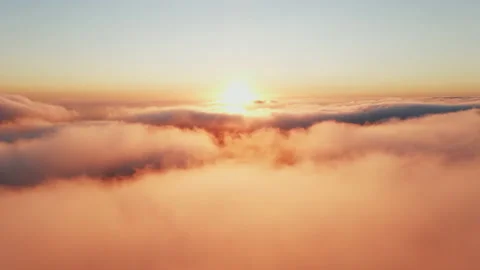Moving white clouds blue sky scenic aerial view sunset. Sun is hidden at fog Stock Footage 142954611