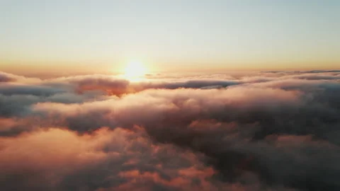 Moving white clouds blue sky scenic aerial view sunset. Sun is hidden at fog Stock Footage 142954687