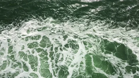 Moving white foam waves created by large boat sailing across a turquoise sea. Stock Footage 172050997
