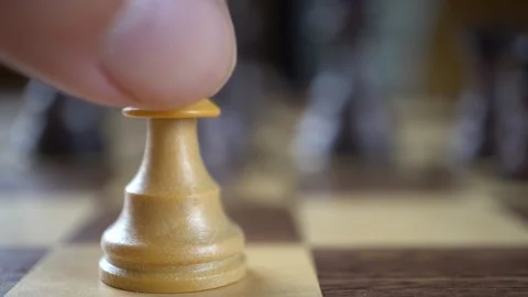 Moving a White Pawn, Slow Motion and Macro Stock Footage 97670832