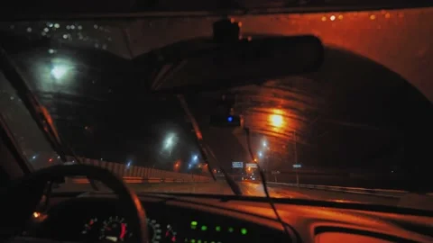 Moving windshield wiper in action during rainy drive. View from inside. Video stock 234226168