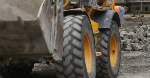 Moving Yellow Excavator Empty Scoop Close Up Worker in Orange Workwear Road Stock Footage 54334132