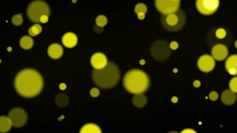 Moving yellow particles background with bokeh seamless loop animation on blac Stock Footage 219596884